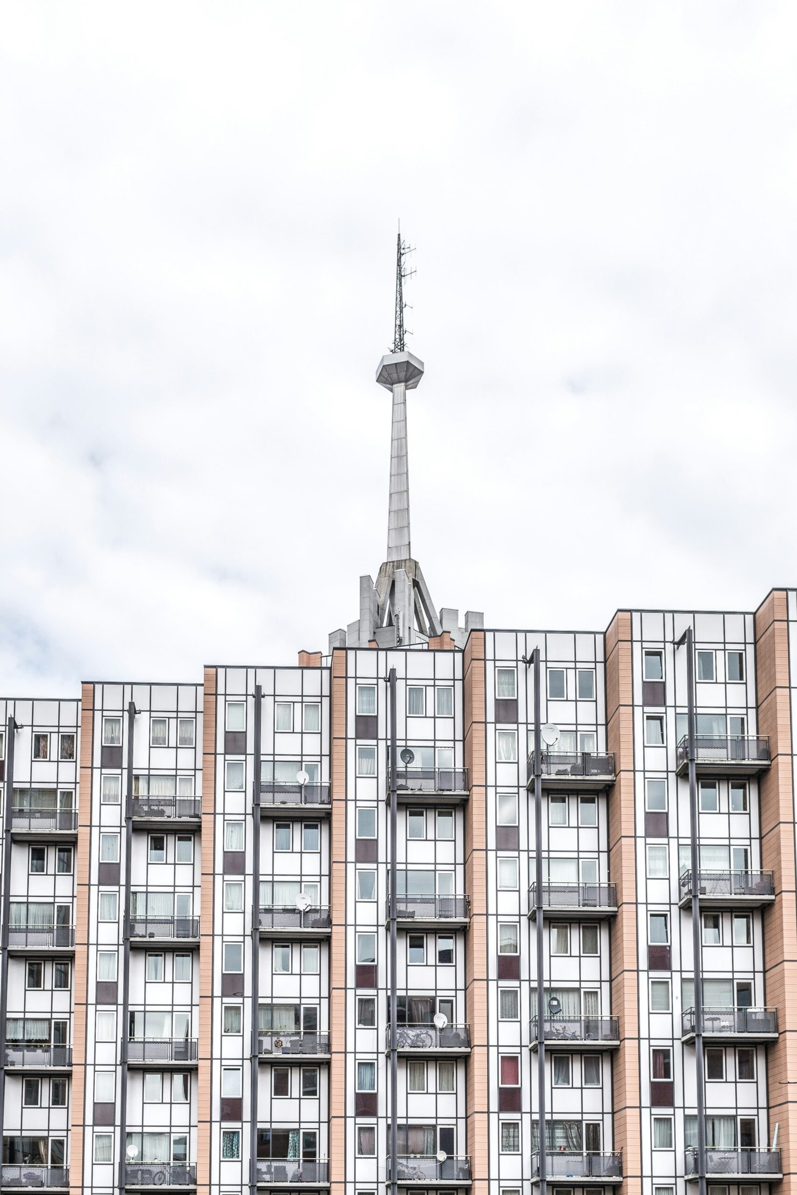 brown and white painted building and tower at daytime